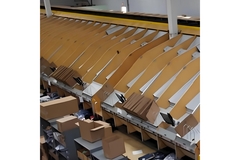 Image A warehouse with boxes on shelves.