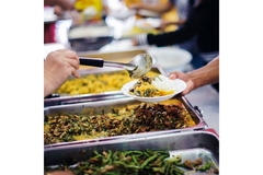 Image Person who is served a meal at a food bank.