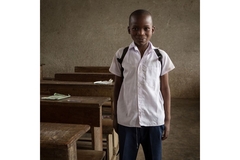 Image A child standing in a classroom in Sierra Leone.
