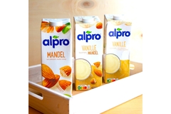 Image three alpro milk containers.