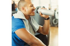 Man drinking a beverage post-workout with Magshape powder mixed in.