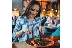 Image Woman eating a low-carb meal.
