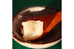 Image dollop of fat on wooden spoon
