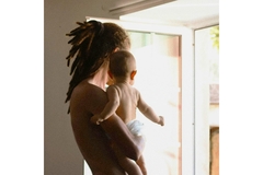 A man holding a baby.