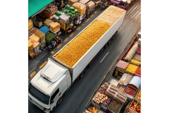 Image a truck with fruits in a food facility.