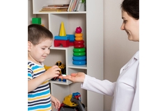 Image A doctor giving a patient a probiotic supplement.