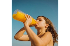 Image A child drinking from a bottle.