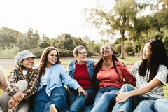 Image Different generations of women all laughing.