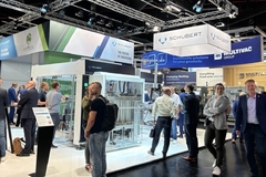 Image A group of people at Schubert-Consulting stand during the event.