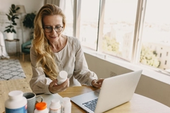 Image Woman researching biotic supplements online.