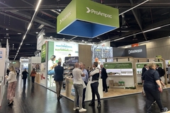 A group of people in ProAmpac stand.