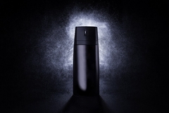 Image Man applying deodorant spray