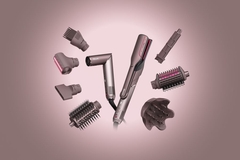 Image hairdryer surrounded with different changeable styling heads