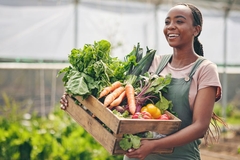 Food System innovator carrying vegetables