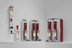 Image Smirnoff Vodka bottles in dispensing system.
