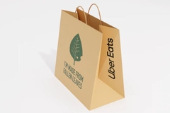 Image A brown Uber bag with a leaf logo on it