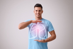 Image Man holds image of healthy lungs