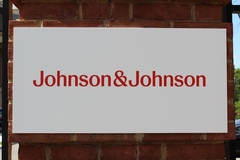 Image Johnson & Johnson sign on the side of a building.