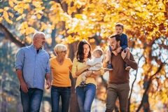 An extended family walking down the street.