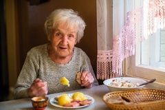 Image Older woman enjoying a meal alone