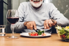 Image Older man eats steak