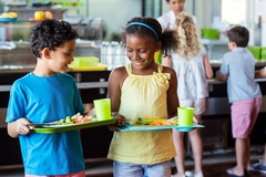 Image Kids in line to get school lunches.