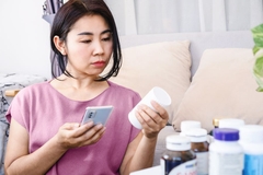 Woman checking supplements on her computer.
