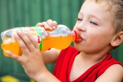 Kid drinks soda