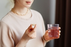 Image Girl takes omega-3 supplement