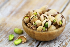 Image A bowl of pistachios.