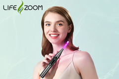 Image A woman holding a wand with purple light at the end.