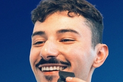 A man shaving his mustache with a Gillette razor.