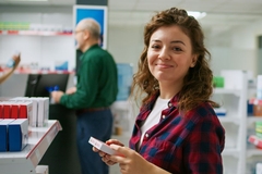 Image Woman buying a supplement.