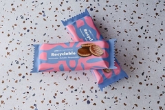Image A pink and blue package with a white label saying recyclable.