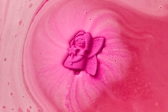 Image A snow fairy bathbomb in water.
