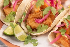 Image tacos on plate with lime on side