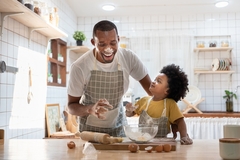 Image father and young son baking at home.