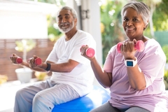 Image Older man and woman exercising.