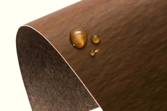 Brown sheet of paper with water drop.
