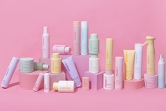 collection of pastel colored personal care product containers