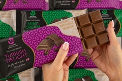 Image A person holding a chocolate bar.
