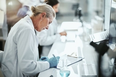 Image A scientist looking at evidence on prebiotic-mediated benefits.