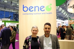 Fernandes and Van Herck smiling in fron of Beneo logo at trade show
