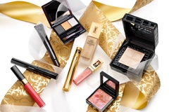 A collection of YSL makeup products on a table.
