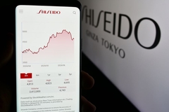 Image A phone with the Shiseido stock on the screen.