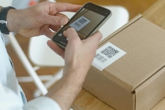 Image Scanning QR code on parcel.