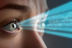 Image a woman's eyes emitting blue rays.