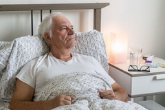 Image Senior person in a hospital bed.