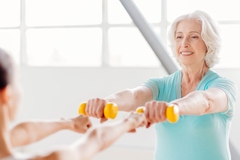 Image Elderly woman working out with weights