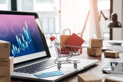 mini shopping trolley on laptop